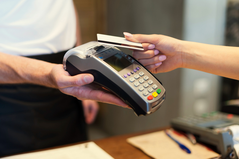 Customer paying through handheld POS